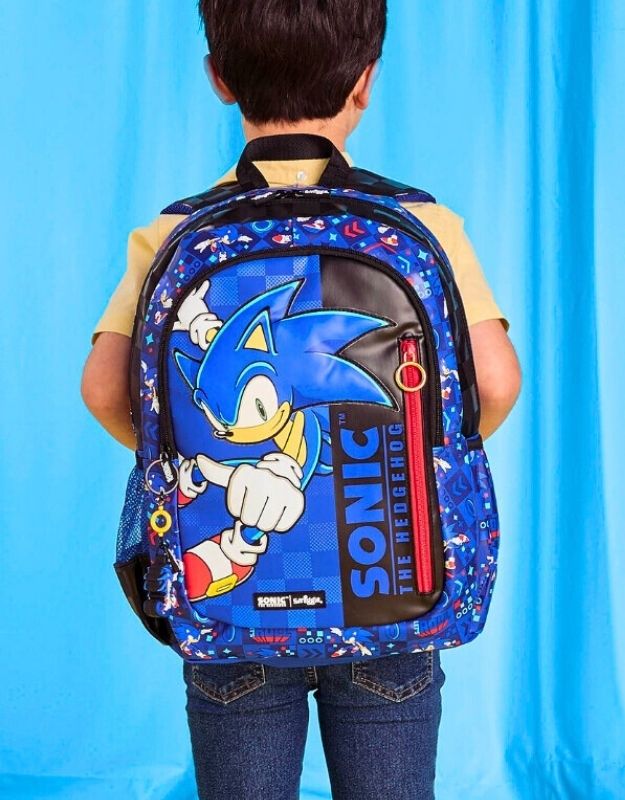 Child wearing Smiggle 15-inch Sonic The Hedgehog Classic School Backpack, blue with Sonic graphic